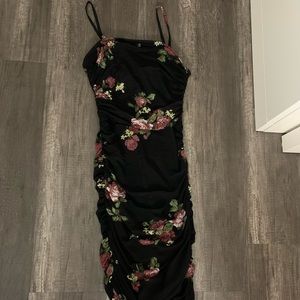 Black floral tight mini dress.